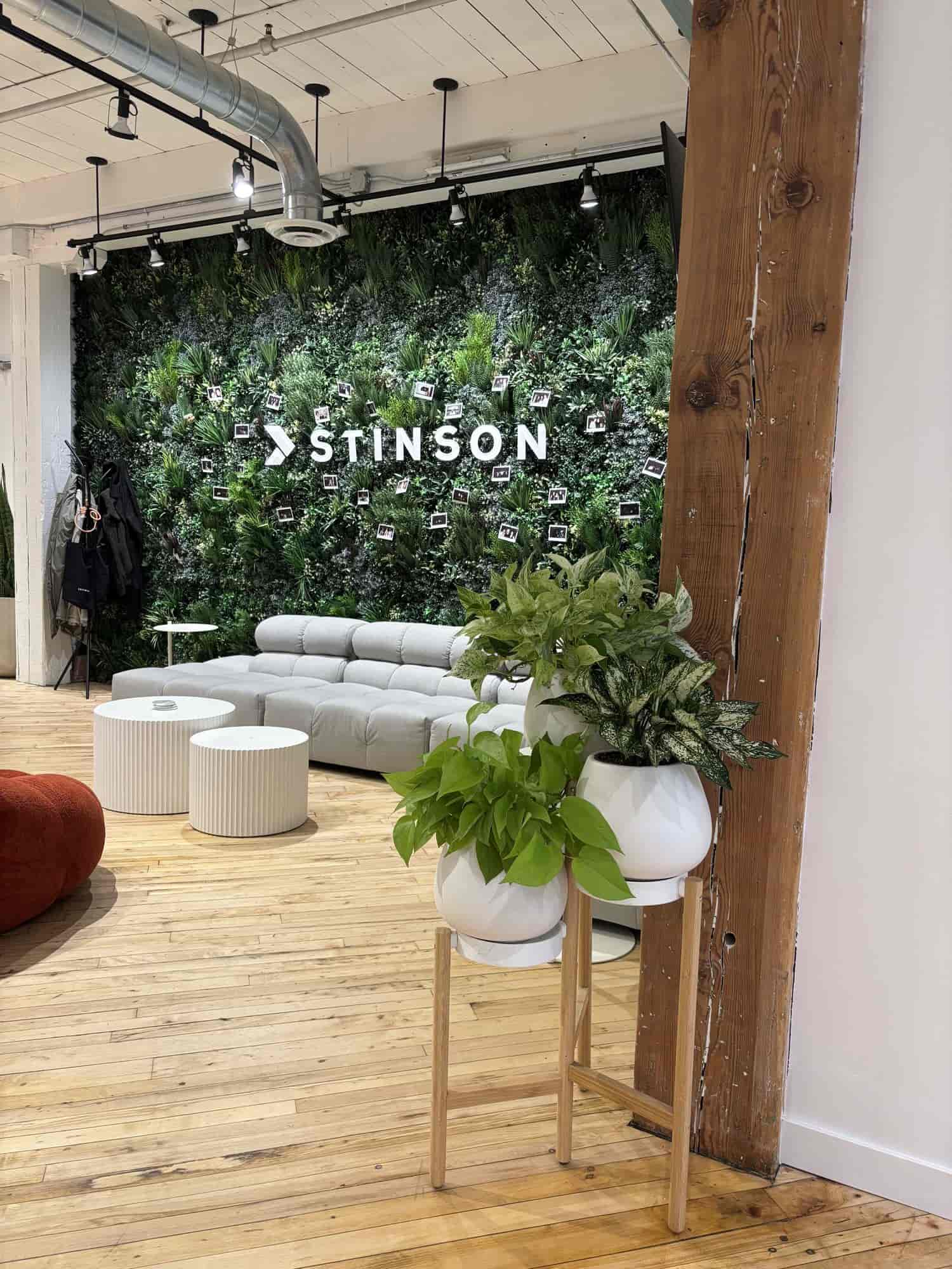 Green wall with a client's logo set into the plants, in an office lobby