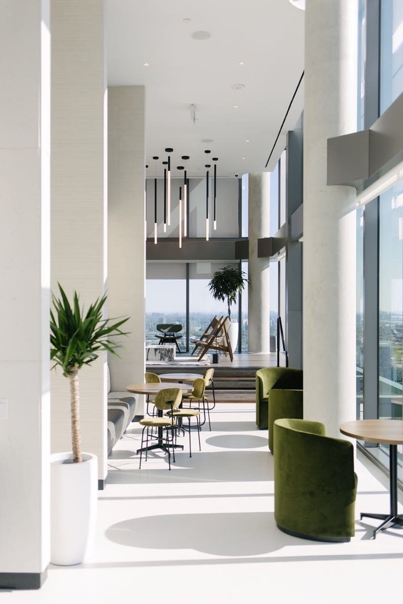 Premium office lounge with carefully placed plants and modern furniture